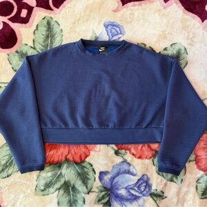 navy blue nike cropped crewneck sweater.